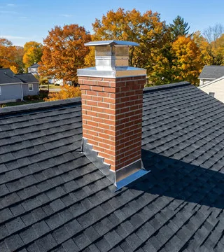 After: new red brick chimney with stainless cap and clean flashing